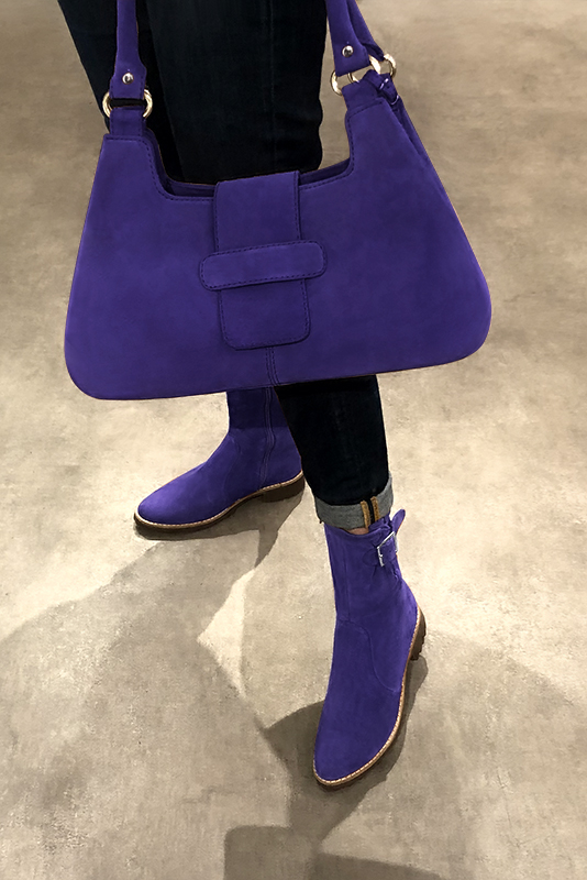 Violet purple women's ankle boots with buckles on the sides. Round toe. Flat rubber soles. Worn view - Florence KOOIJMAN